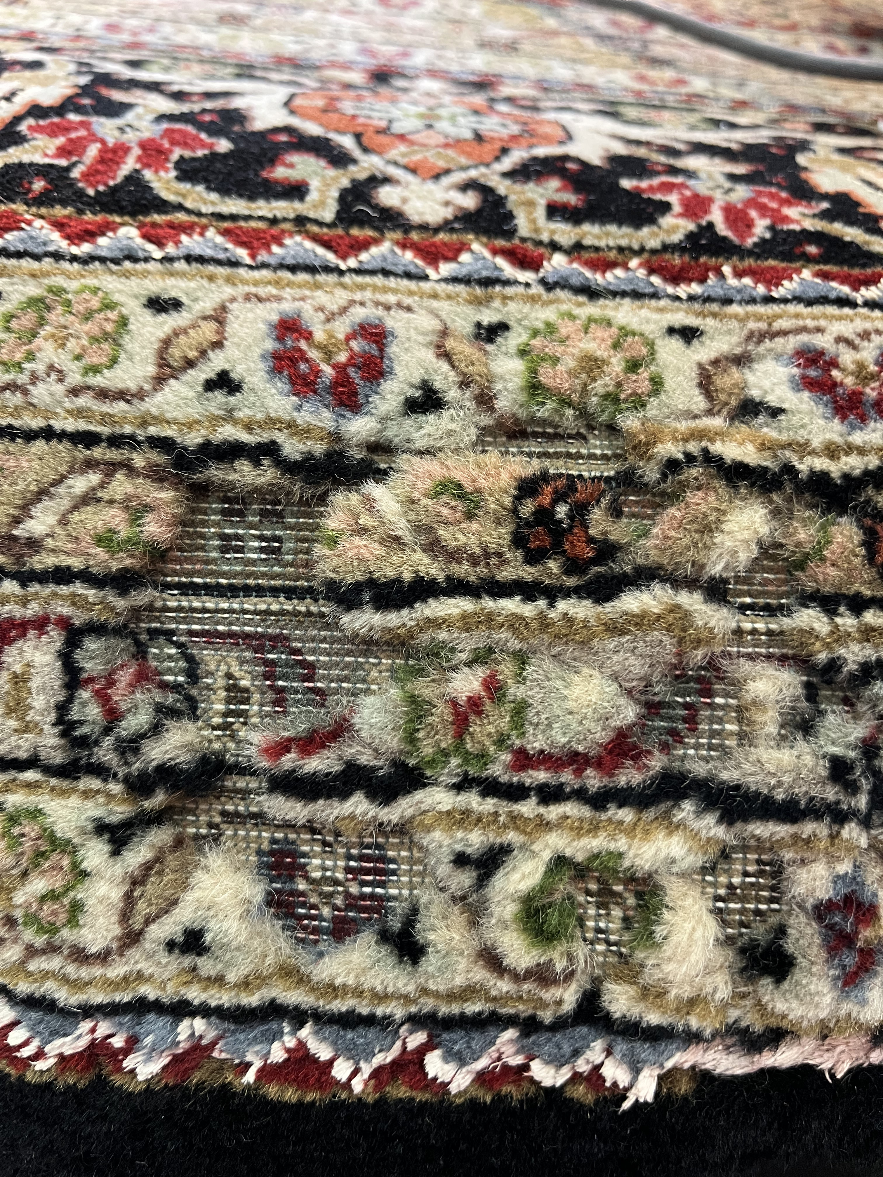 Damaged rug before restoration